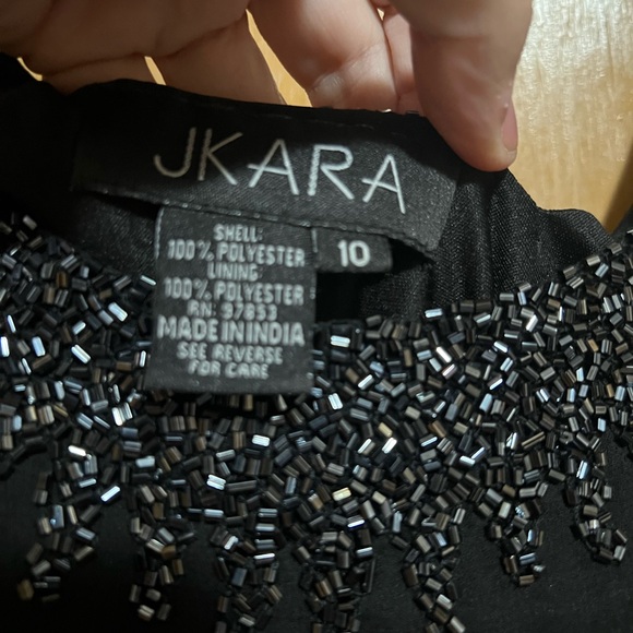 Elegant Black Sleeveless Dress with Embellished Neckline - Picture 2 of 5